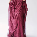 Flowing scarlet red maxi dress with delicate floral embroidery and gathered chiffon fabric details.