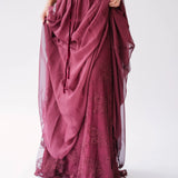 Flowing scarlet red maxi dress with delicate floral embroidery and gathered chiffon fabric details.