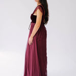 scarlet red floor-length gown with lace cap sleeves and a velvet corset bodice.