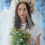Bridal-inspired styling of The Princess Kitten Tee with a flower crown and veil, holding a bouquet to highlight the tee’s romantic charm.