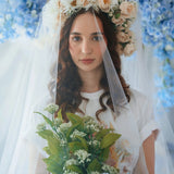 Bridal-inspired styling of The Princess Kitten Tee with a flower crown and veil, holding a bouquet to highlight the tee’s romantic charm.