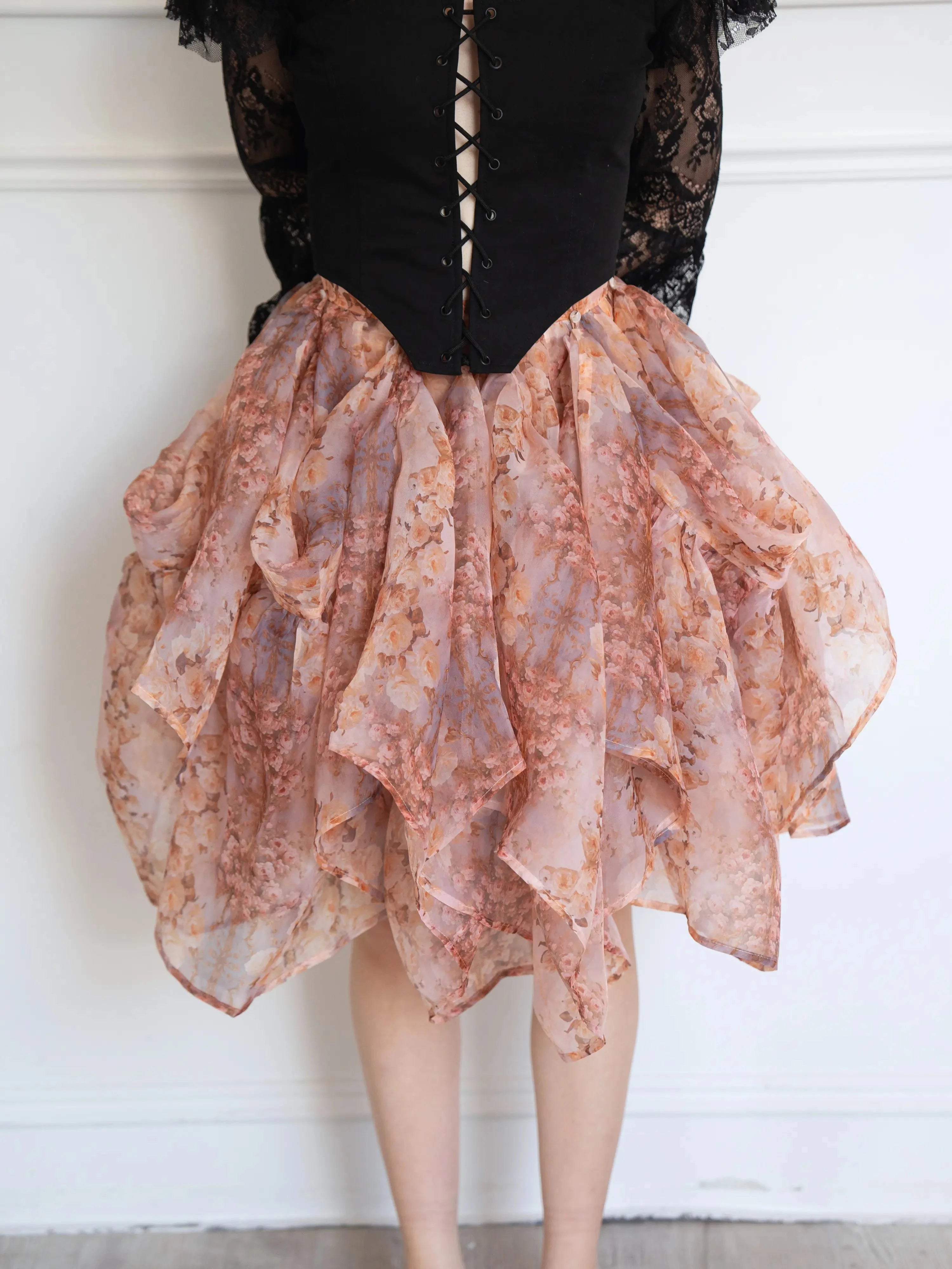 Close-up of The Twilight Bloom Bustle Skirt highlighting its cascading floral organza layers and romantic silhouette.