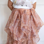Plus-size model in The Twilight Bloom Bustle Skirt paired with a cute animal graphic tee, showing the high-low bustle detail.