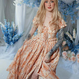 Romantic Twilight Bloom Meadow Gown styled in a floral studio, featuring layered skirt and sweetheart neckline.