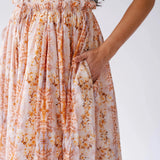 Close-up of Twilight Bloom Meadow Gown showing floral cotton fabric and hidden side pocket detail.