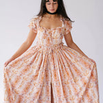 Twilight Bloom Meadow Gown with puff sleeves and floral print, shown front-facing with full skirt spread out.