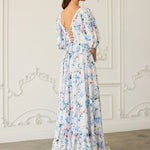 Floor-length floral print ball gown with puff sleeves and an open back corset design.