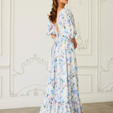 Corset maxi dress with ruffled tiers and puff sleeves in a white and blue floral print called Wildbloom.