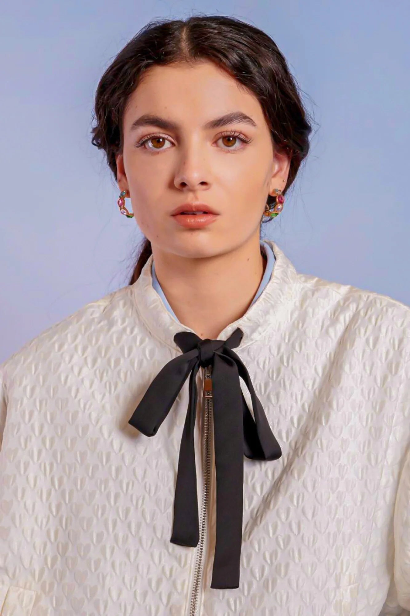 Young woman in white blouse and black bow tie with Adella Jacquard Bomber Jacket