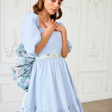 Light blue floral Josephine midi dress with ruffled tiers and white belt