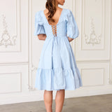 Light blue Josephine Midi dress with puff sleeves and tiered skirt for elegant style