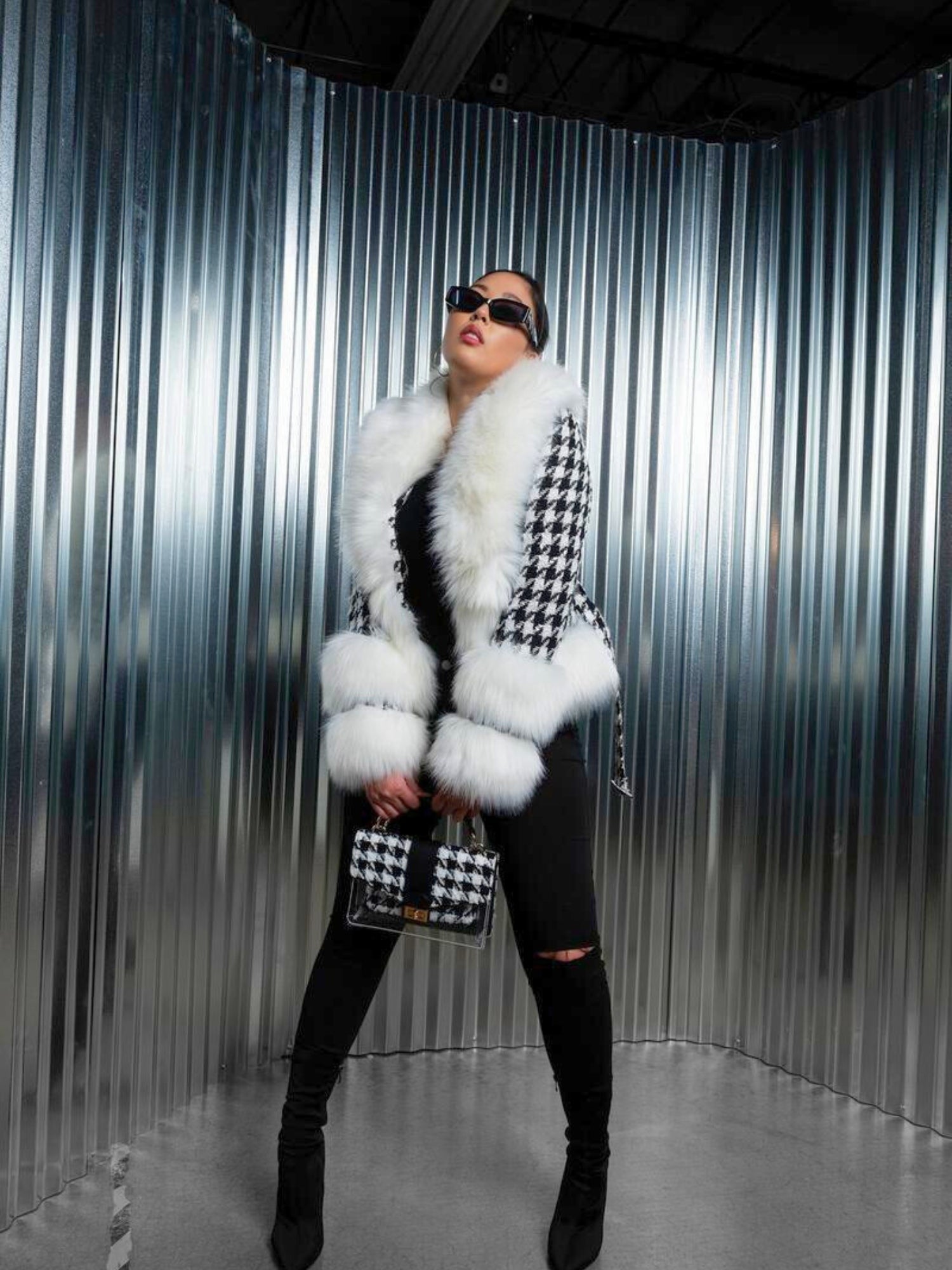 Fashionable person in The Annetta Faux Fur Jacket with a stylish checkered design