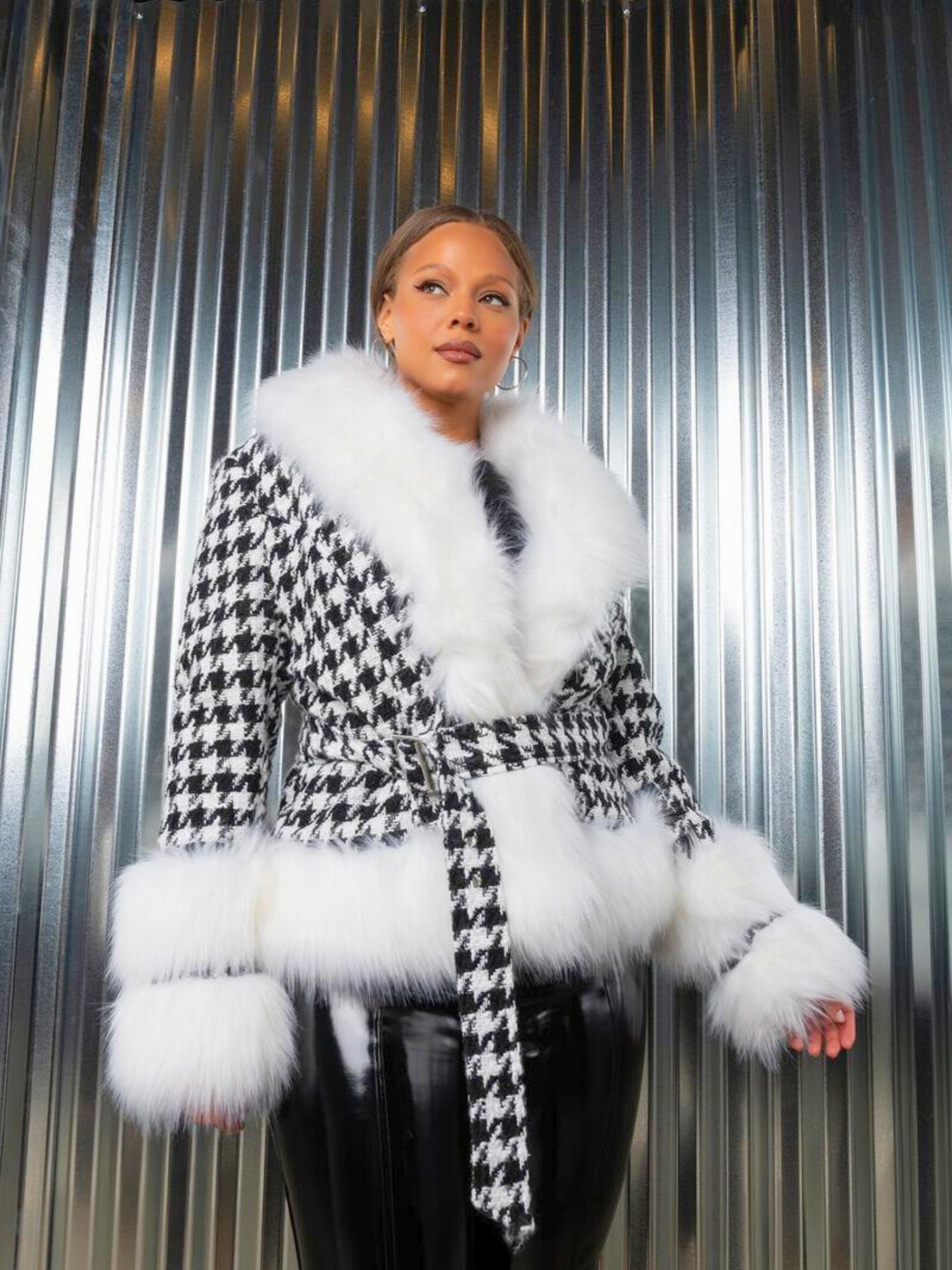 Stylish houndstooth coat with white faux fur trim, perfect for elegance and warmth