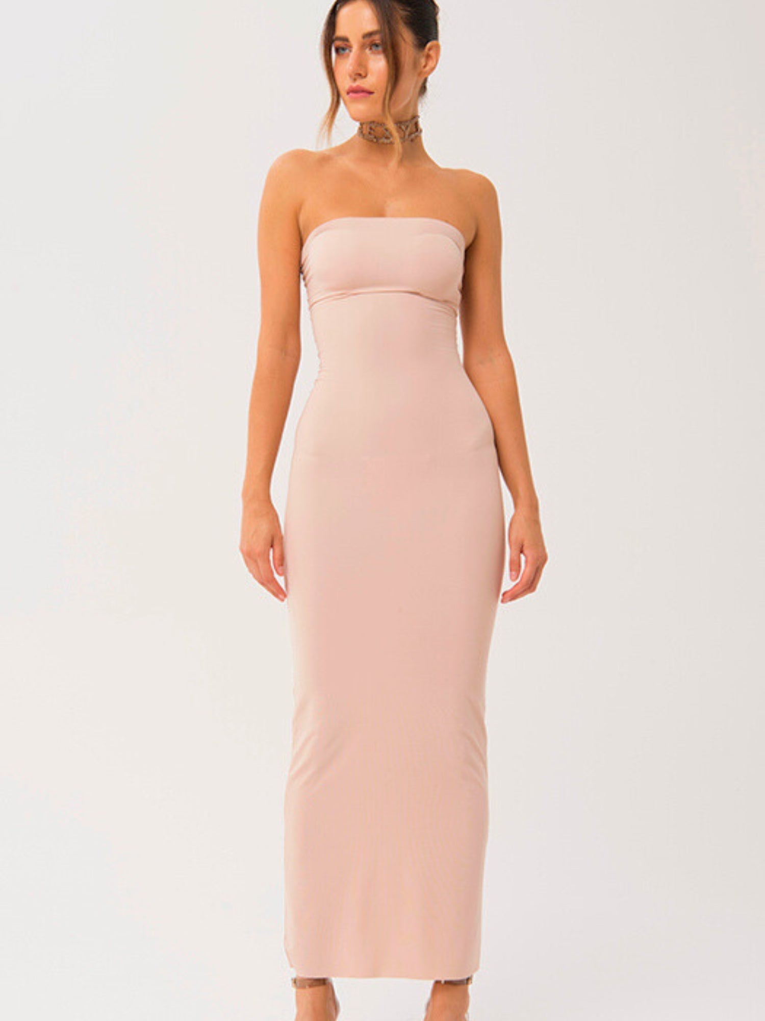 Woman wearing the Barely There Strapless Long Cami Slip Dress in pale pink