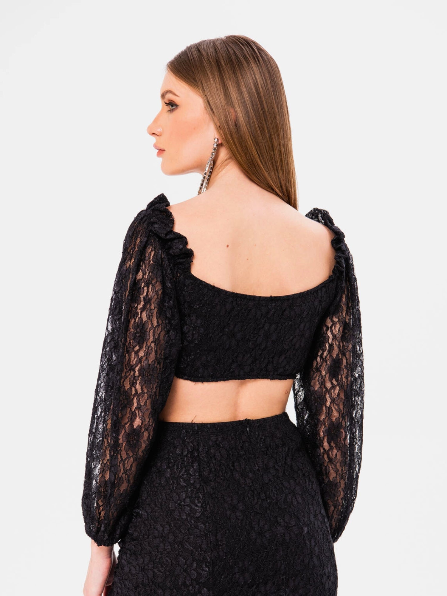 Black Magic Lace Crop Top featuring long sleeves and an elegant open back design