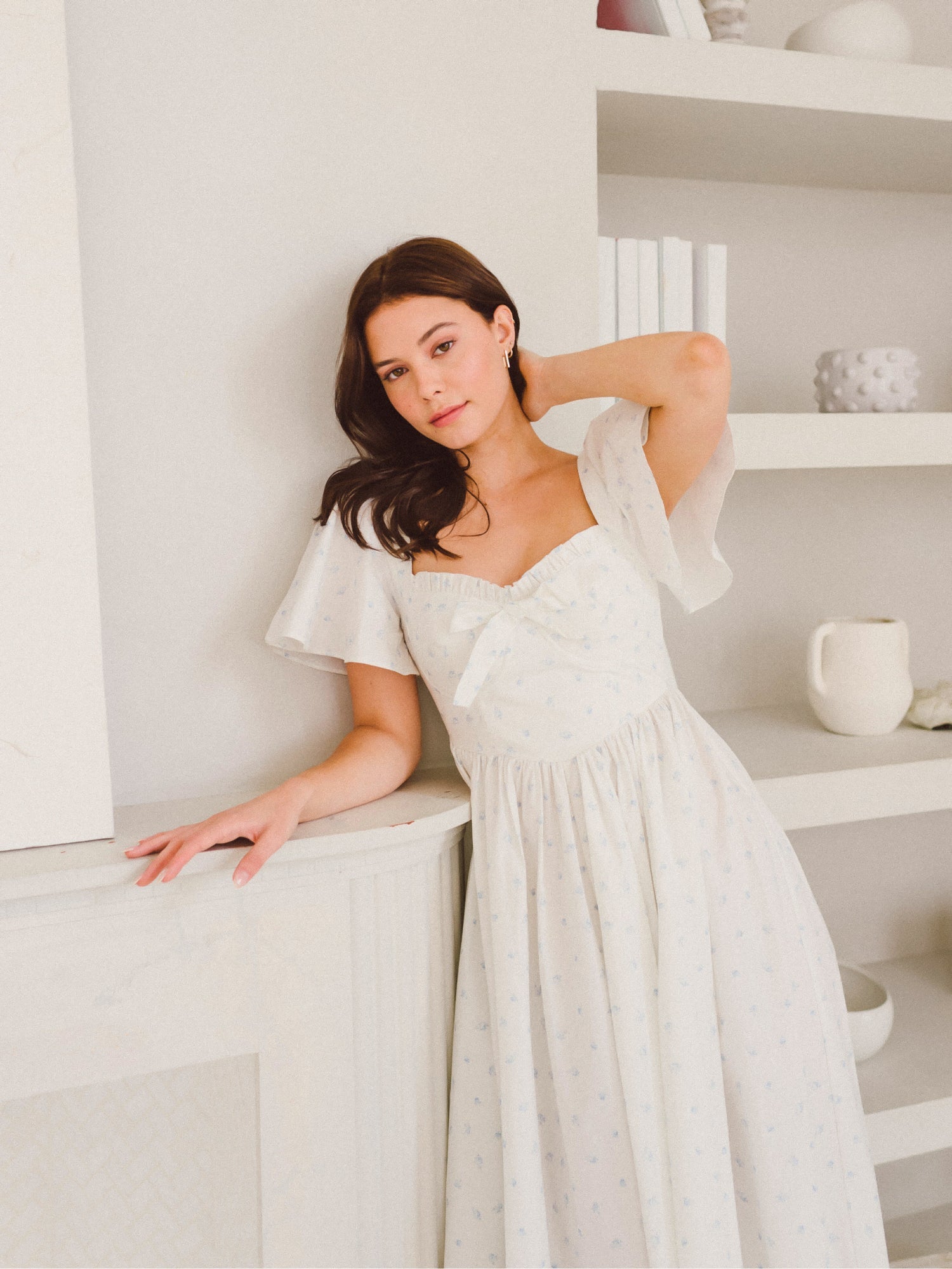 Woman in a white flowing skirt dress from the Blue Blooms French Milkmaid collection