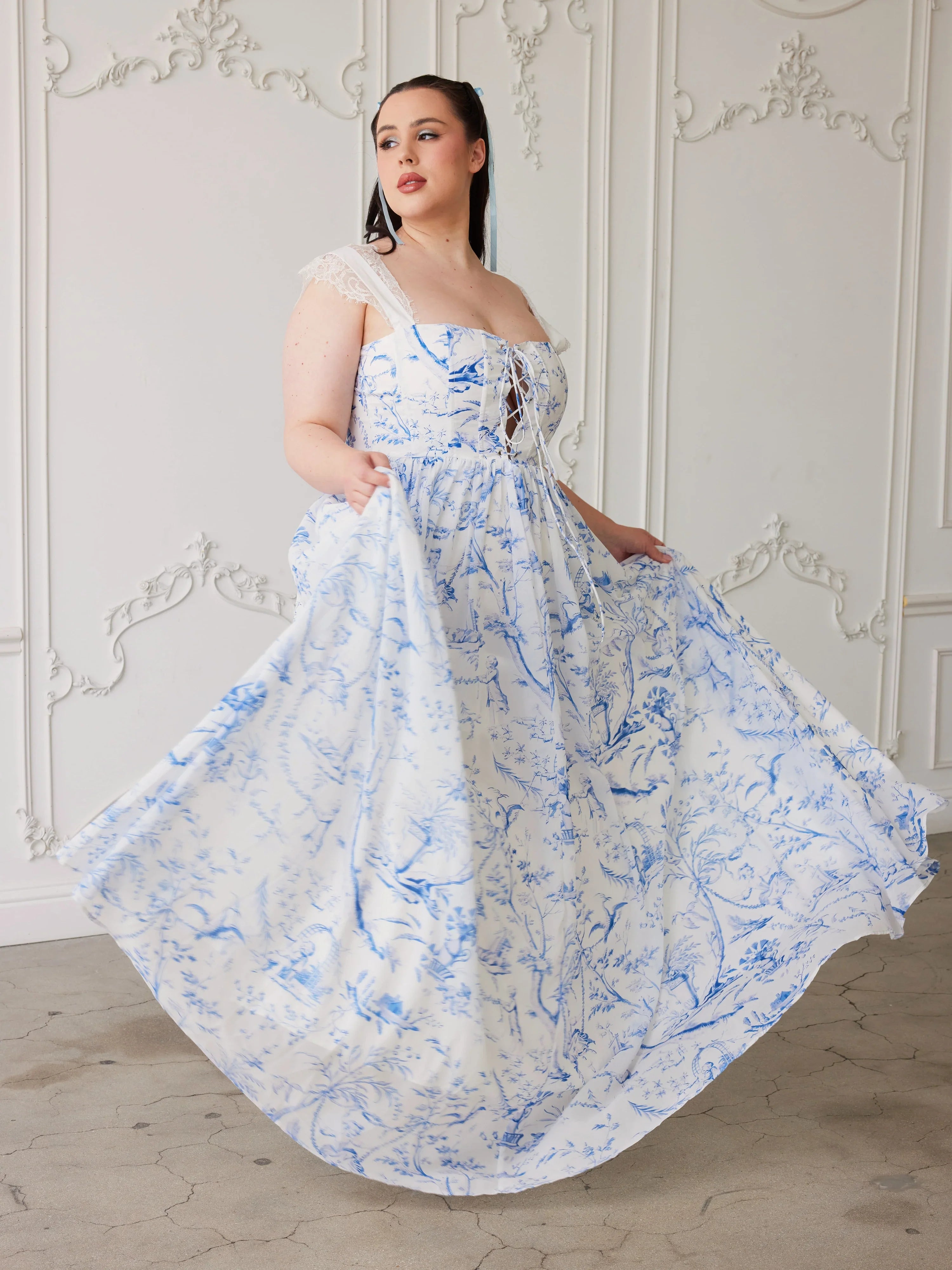 Flowing white and blue floral gown with off-shoulder design in Blue Toile Lovers Gown