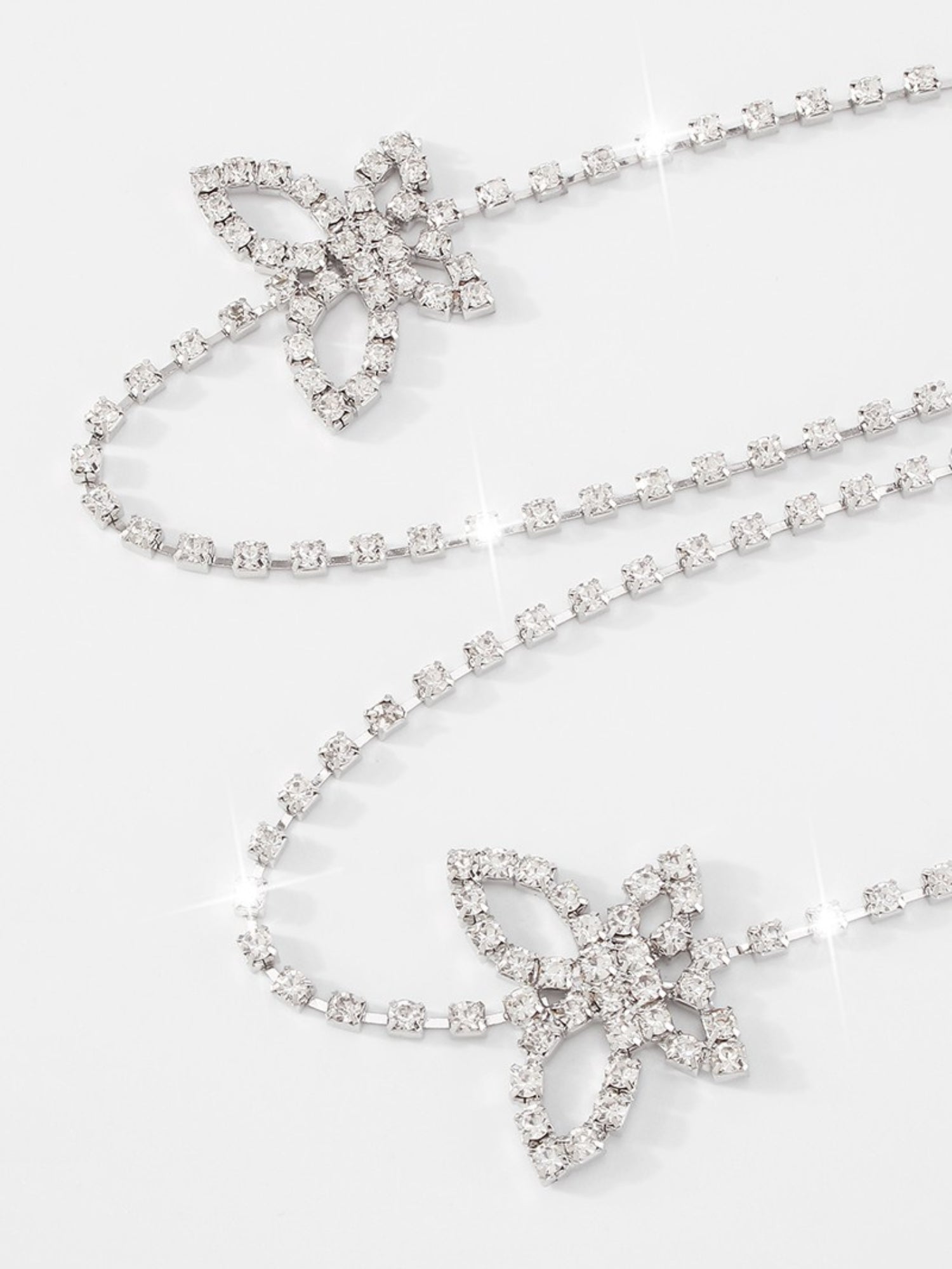 Delicate diamond necklace with floral pendants for The Butterfly Bra Strap