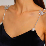 Sparkling rhinestone butterfly bra strap on a stylish black top accessory