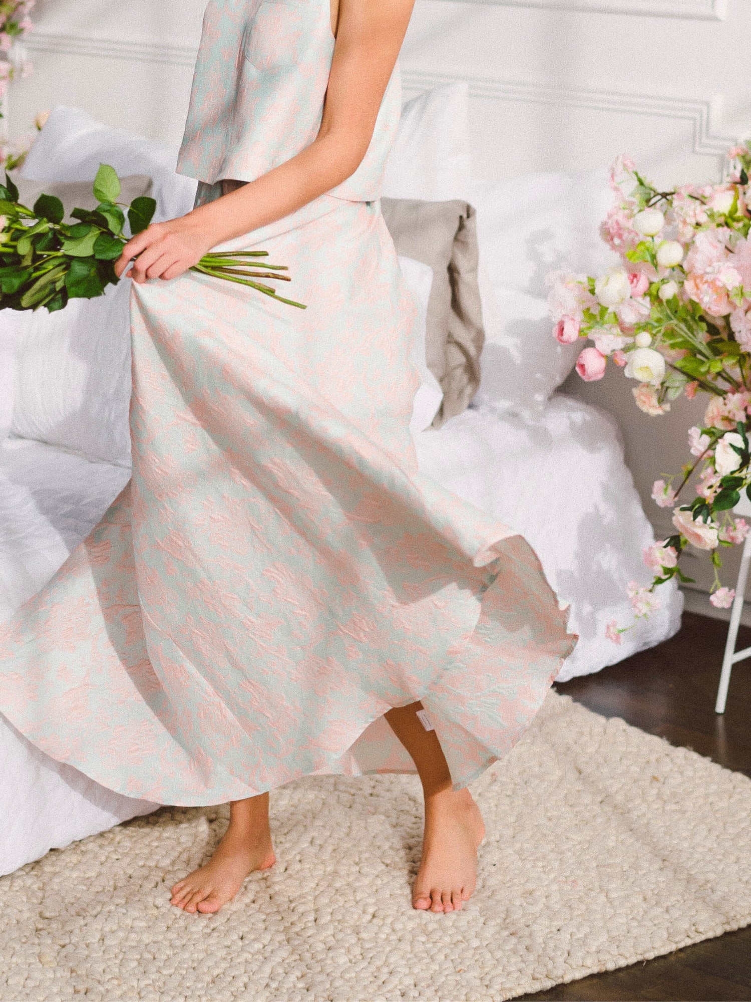 Long white Candy Floss St. Tropez Maxi Skirt with flowing skirt held by a person