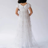 Back view of the Celestial Veil Dauphine Lace Gown showcasing V-back and celestial lace train.