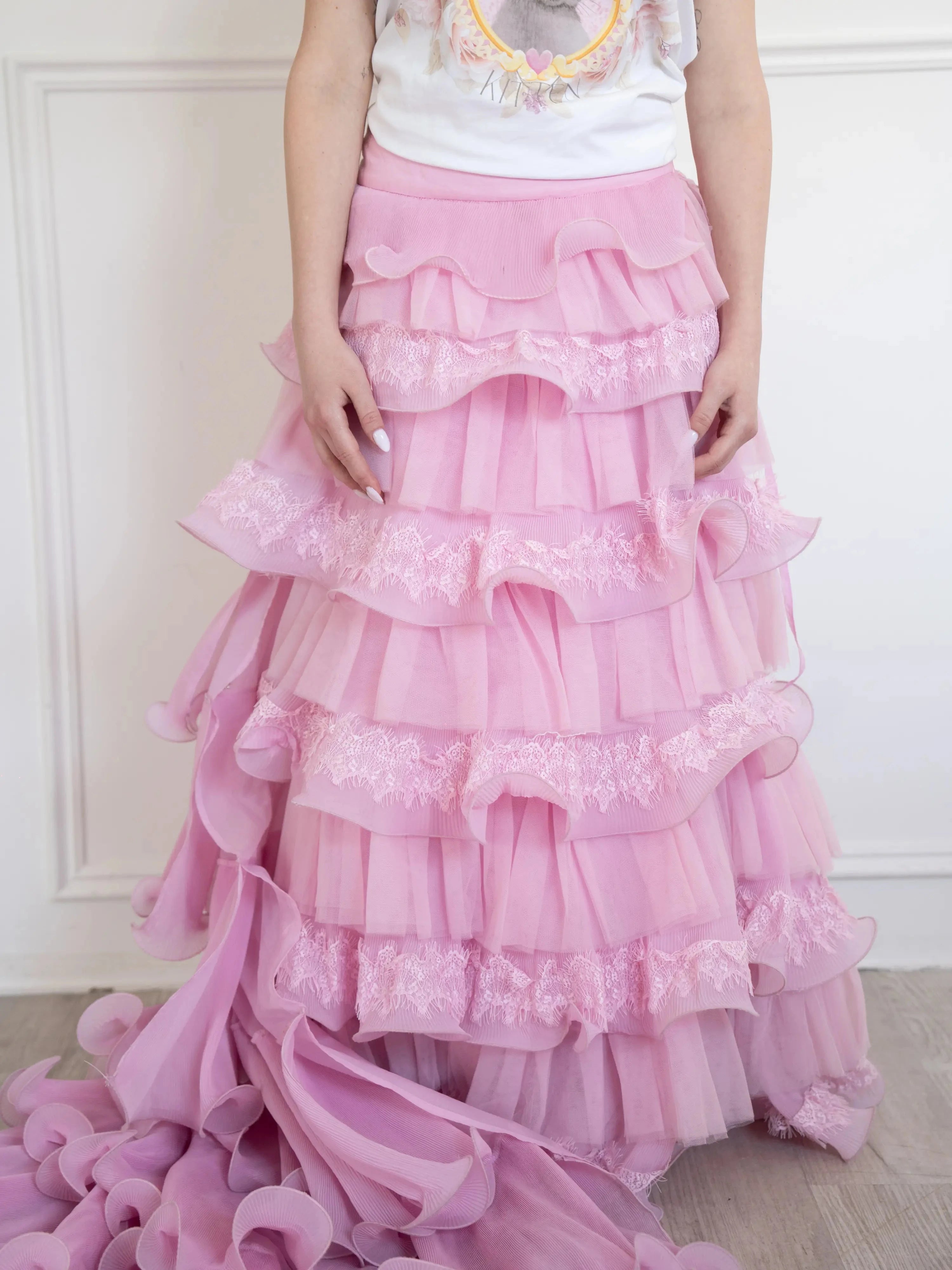 Front view of the dahlia pink ruffle skirt, intricate lace, and ruffle details.