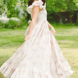 White wedding dress with ruffled tiers and puff sleeves from the Dream Rainbow Apron Maxi