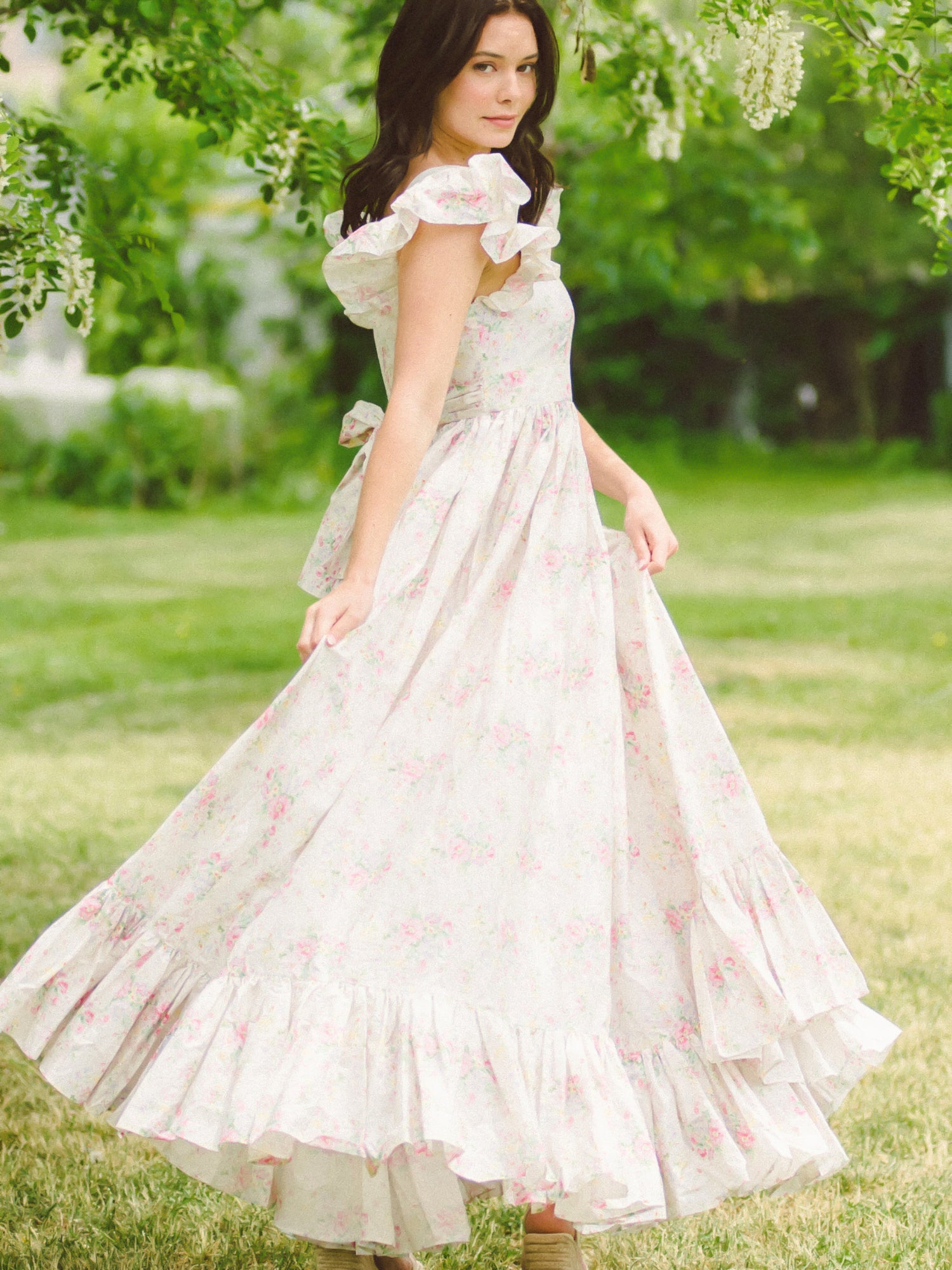 White wedding dress with ruffled tiers and puff sleeves from the Dream Rainbow Apron Maxi