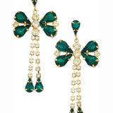 Ornate emerald dragonfly earrings with diamond accents in butterfly shape