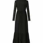A back view of a black cotton dress called the Eveline dress, with lace sleeves and hem on a white background