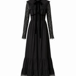 Black cotton dress called the Eveline dress, with lace details on a white background.