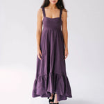 The Everyday Cotton Midi Dress in deep purple with ruched straps and high-low hem.
