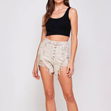 Woman in black crop top and distressed Facing Trouble Denim Shorts with high waist button