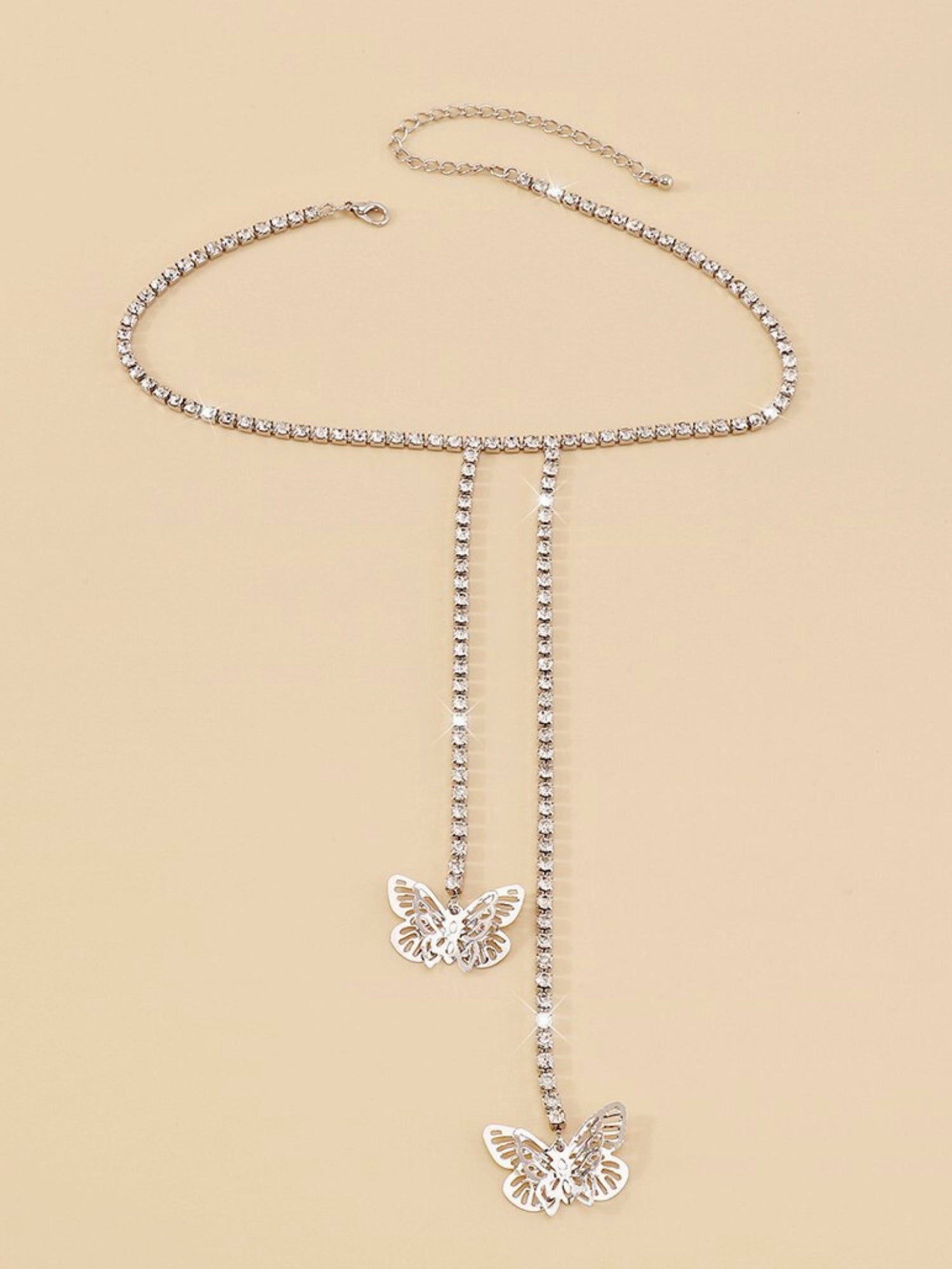 Delicate silver Fairy Flutter Necklace featuring butterfly pendants and dangling chains