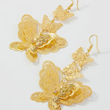 Ornate gold butterfly dangle earrings, a gilded masterpiece tailored for fairytale lovers