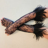 Elegant black lace gloves with feathered cuffs, perfect for a gown or puff dress