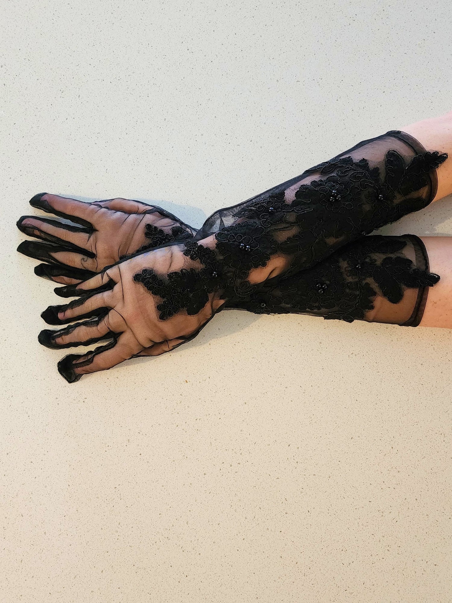 Pair of Fleur Embroidered Gloves featuring long sheer black lace with floral patterns