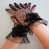 Delicate Fleur Evening Gloves with black floral accents, perfect for a gown or grand bow sash