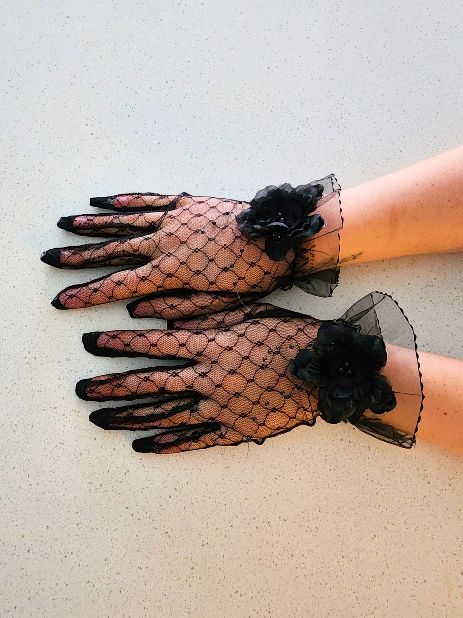 Elegant black lace gloves with floral accents to complement your Fleur Evening gown