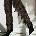 The Fringe Thigh High Boots by Azalea Wang with gold studded fringe and stiletto heels, styled for a bold over-the-knee fashion statement.
