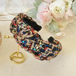 Colorful tweed headband with intricate patterns and knotted design, perfect for gowns