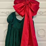 Dark green dress with puffed sleeves and a large red bow for bow lovers, Grand Bow Sash