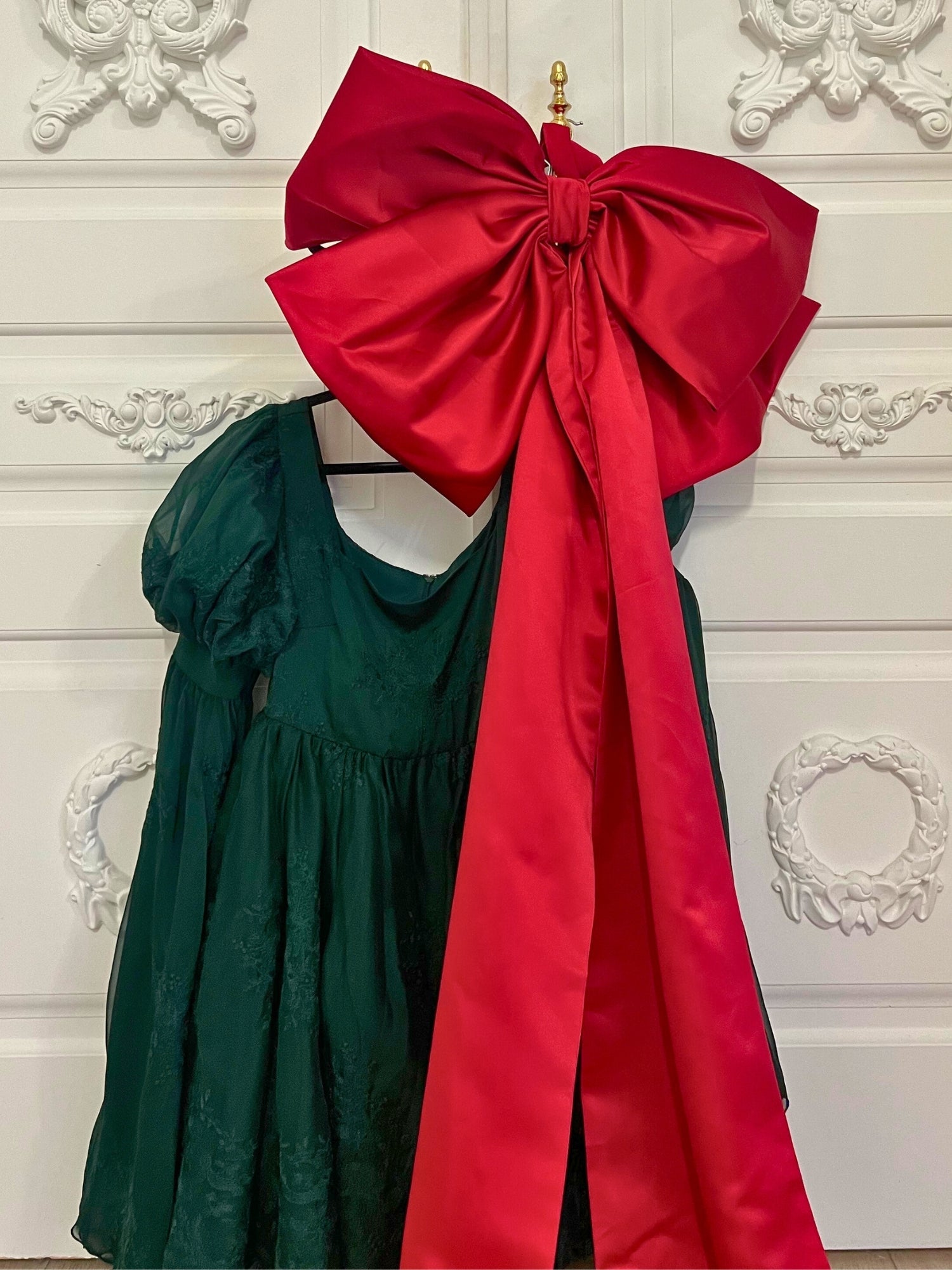 Dark green dress with puffed sleeves and a large red bow for bow lovers, Grand Bow Sash