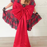 Plaid dress featuring a grand bow sash on the back, perfect for bow lovers