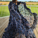 Flowing floral dress in dark blue with lighter patterns, featuring the High Priestess Cape