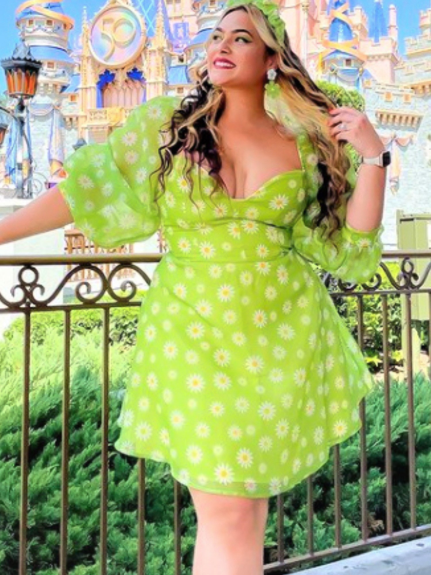 Woman in lime green polka dot dress showcasing the Hippie Daisy Princess Mini Dress