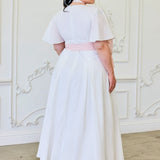 White Ivory Cloud Midi Dress with flutter sleeves and pink sash at the waist