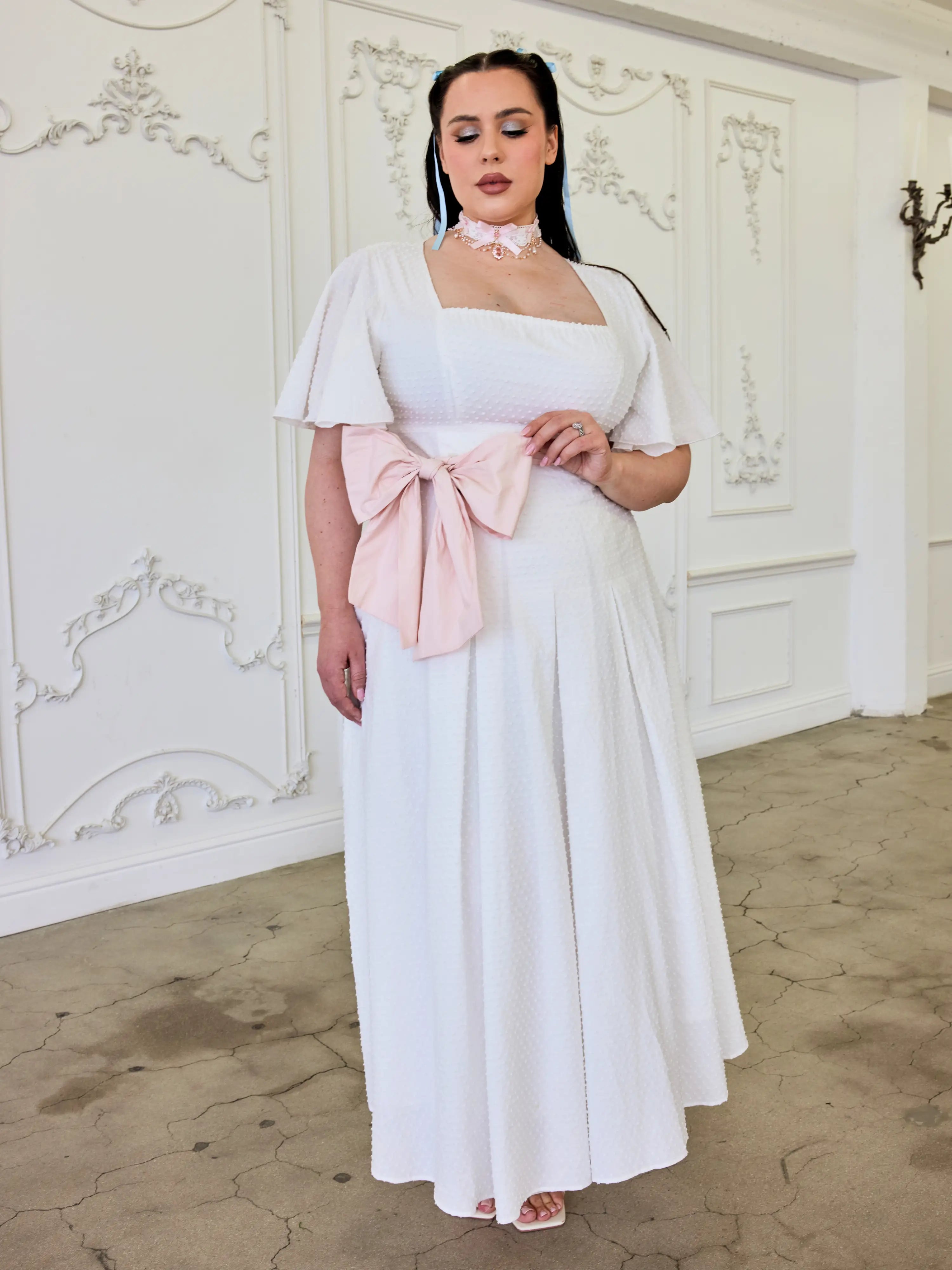 White Ivory Cloud Midi Dress featuring a pink bow sash and off-shoulder sleeves