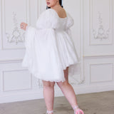 Ivory Fairy Puff Dress featuring a flowy mini style with voluminous sleeves and loose silhouette