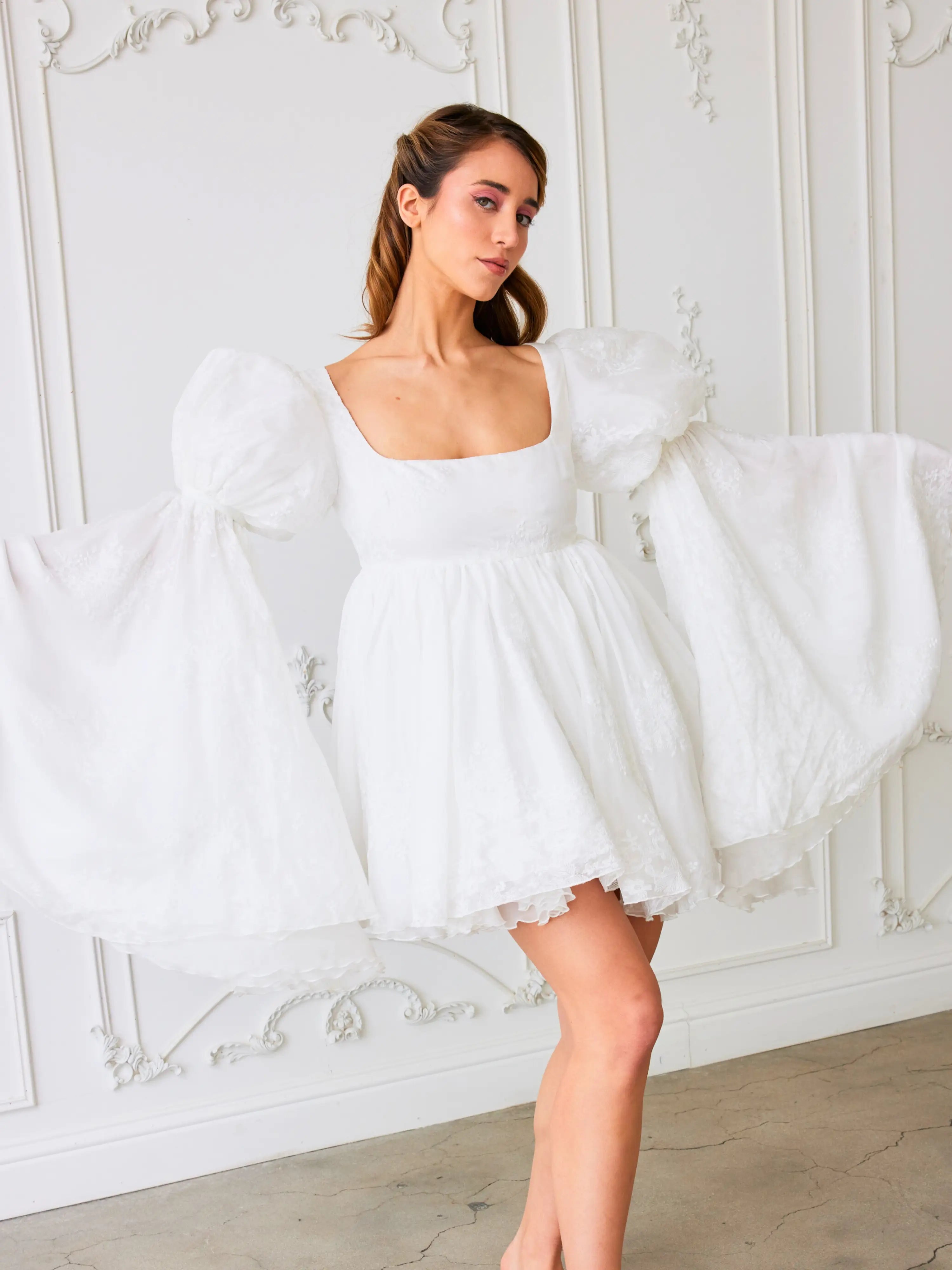 White mini dress with puff sleeves and square neckline, perfect for the Ivory Fairy Puff Dress